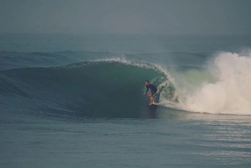 Lewis surfing inside a barrelling wave